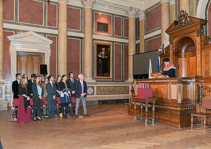 Academic Director of the master's program, Prof Michael Lysander Fremuth and graduates