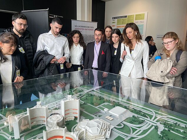 students look at UN replica during visit at UN